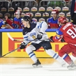 COLOGNE, GERMANY - MAY 21: Finland's Jesse Puljujarvi #39 skates with the puck while being stick checked by Russia's Andrei Mironov #94 during bronze medal game action at the 2017 IIHF Ice Hockey World Championship. (Photo by Matt Zambonin/HHOF-IIHF Images)